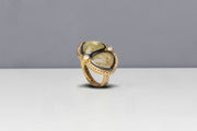 Todd Reed ring with fancy cut diamonds (8.70ctw) and white brilliant cut diamonds (0.66ctw) in 18k yellow gold and sterling silver with patina.